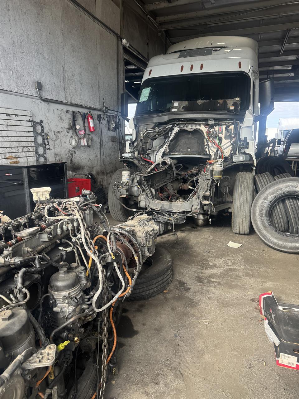 Semi truck front end torn down for major repair in the shop